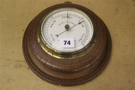 A Negretti and Zamba oak aneroid barometer